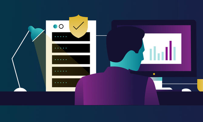 man sitting at computer