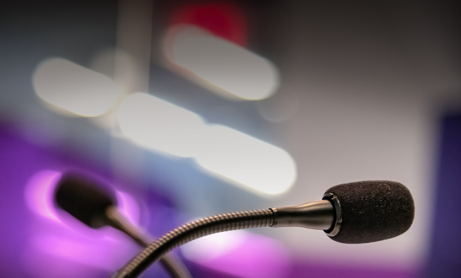 two crossed podcast microphones