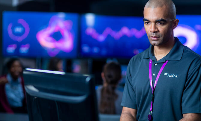 Leidos employee working at computer 
