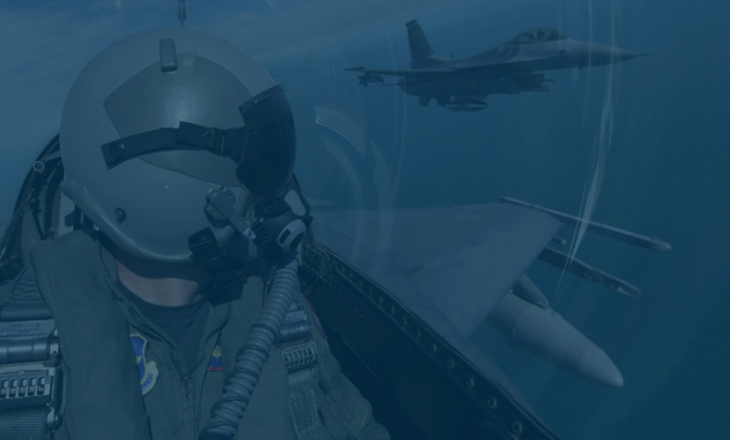 Air Force pilot looking at airplane 