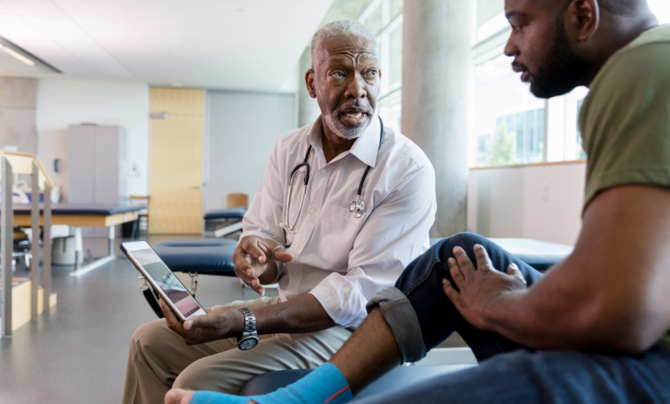 doctor explaining chart to patient