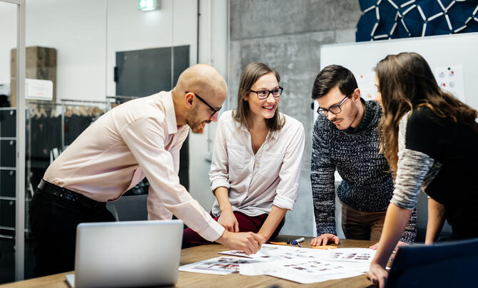 Team collaborating over table