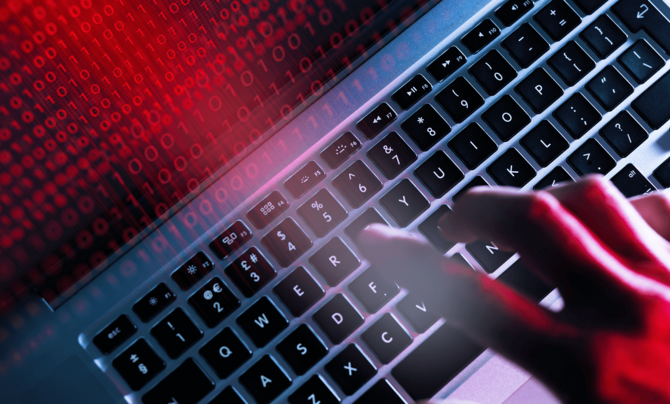 keyboard and screen with code for cybersecurity