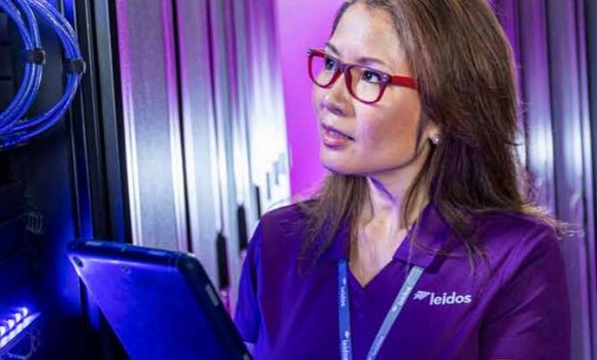 Woman in electronics working on software system