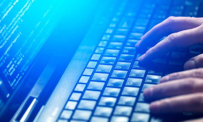 hands typing on a key board