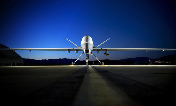 Reaper on runway at night