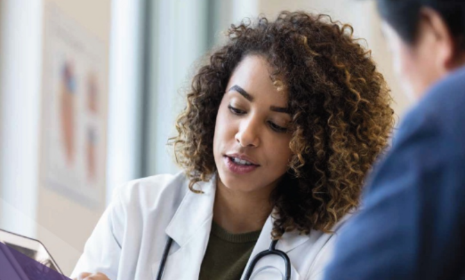 doctor pointing at tablet