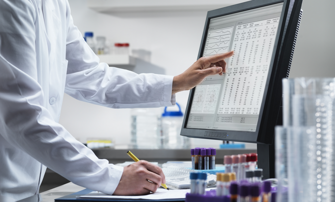 Scientist looking at data on computer