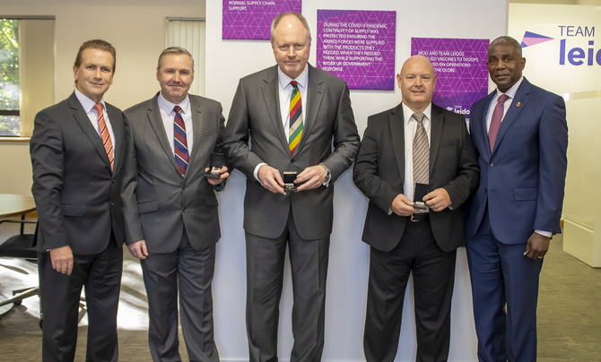 Cameron Macnish, Garrie Seal, and Darren Otterwell with their medals and Darrell K. Williams
