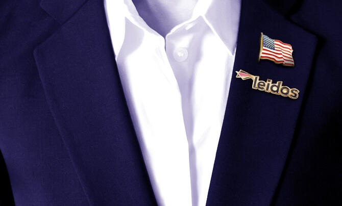 Veteran employee with United States pin and Leidos pin