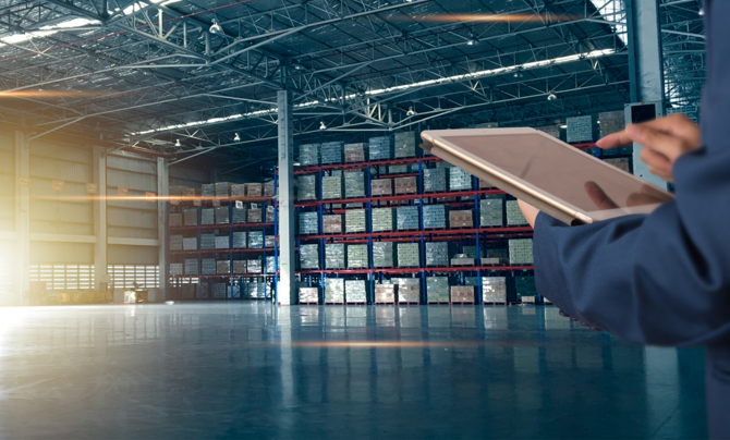 warehouse and employee using tablet