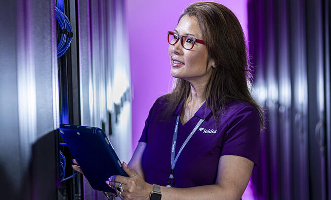 Leidos employee with table checking servers 