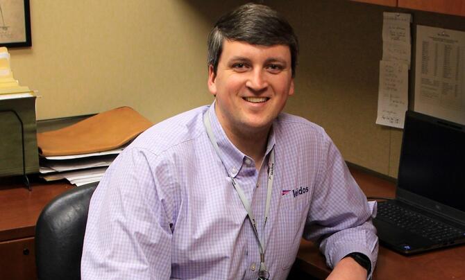 Photo of rotational program participant at his desk