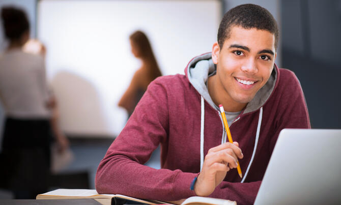 teenage boy with laptop