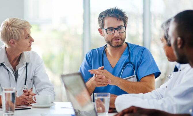 doctors talking at a conference table