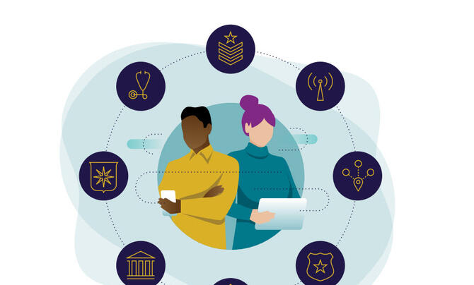 two employees with devices