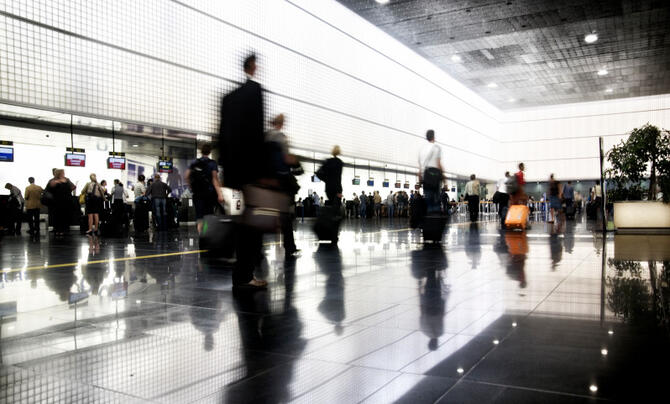 Passengers walking in airport terminal