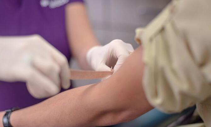 QTC taking blood from veteran