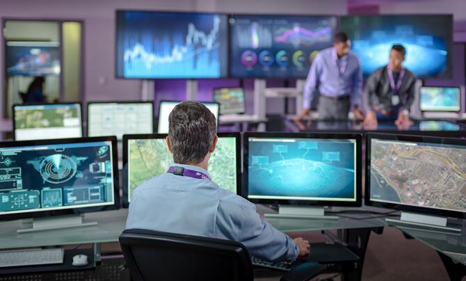 leidos employee working with dashboards and geospatial technology