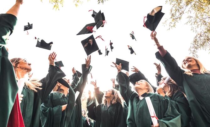 New graduates tossing their caps in celebration