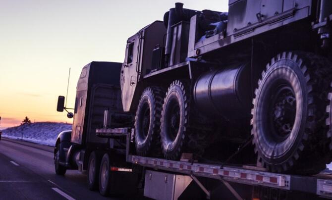 18-wheeler on road at sunrise