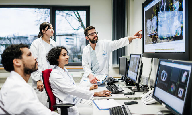 doctors analyzing imagery and data