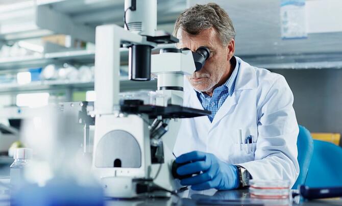 scientist with microscope