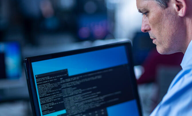 Man working with data on a screen