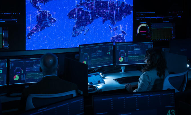 People working on computers in security facility