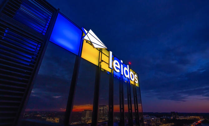Leidos Global HQ building lit in the colors of Ukraine