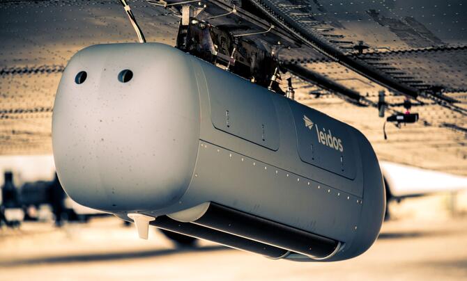 A Leidos military pod attached to a Douglas DC-3 test aircraft