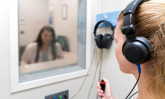 woman completing hearing test