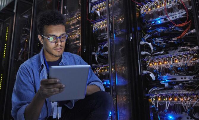 Programmer executing tasks in a server room