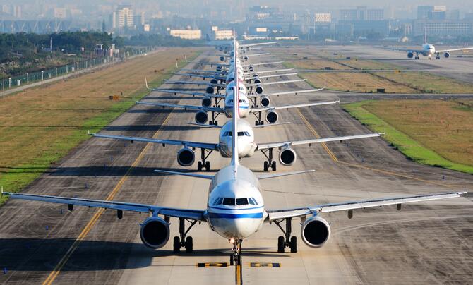 Planes lined up on runway 