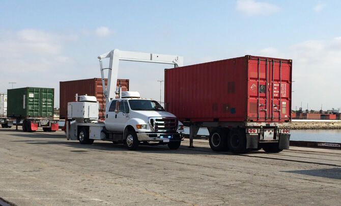 Cargo trucks near a body of water