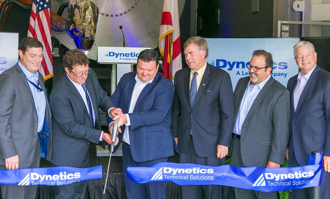 Dynetics leadership cutting a ribbon during ceremony