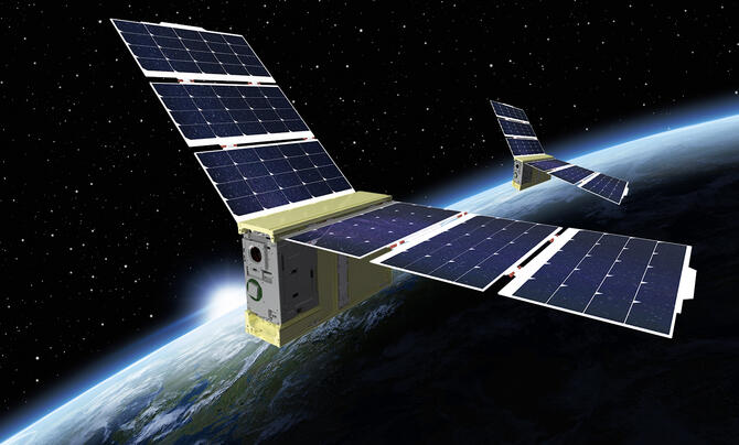 Two space satellite payloads orbit the Earth
