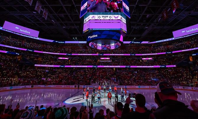 Capital One Arena lit up in purple before an NHL hockey game