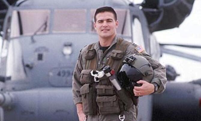 John Alvarez standing in front of an aircraft