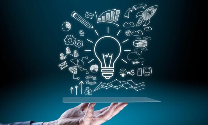 A lightbulb with many other graphics surrounding it