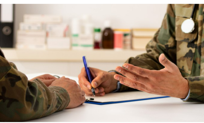 Military doctors consulting one another