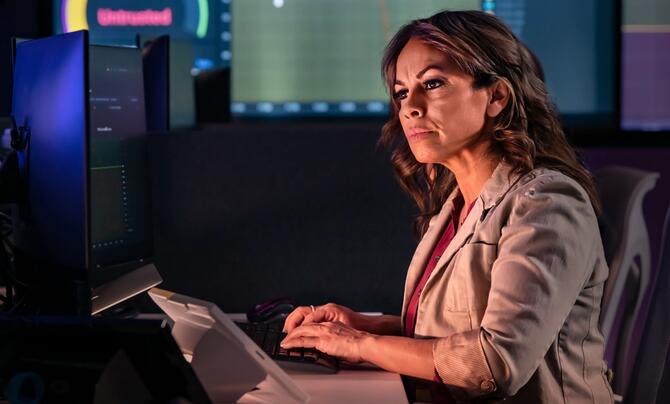 women in cyber lab working on computer