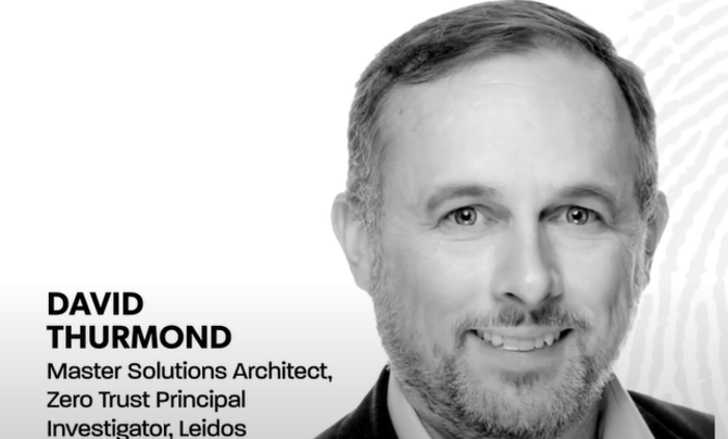 A man, smiling on a white background