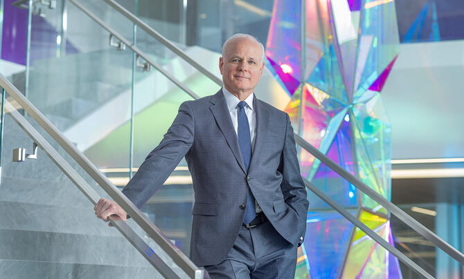 Thomas Bell standing in a stairway at Leidos GHQ