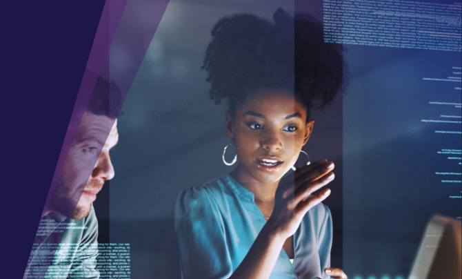 A woman teaching a man in front of screens