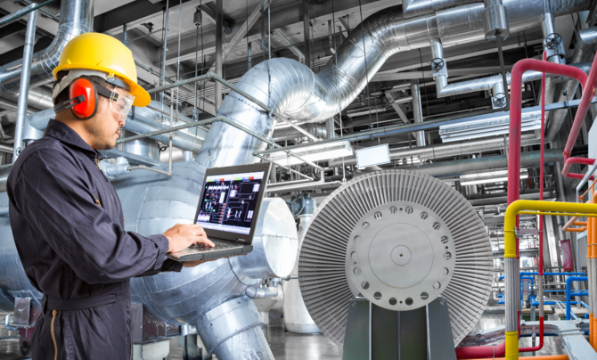 Person in an industrial setting performing monitoring activities