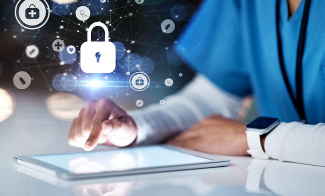 Someone working on a tablet with cyber graphics over the finger