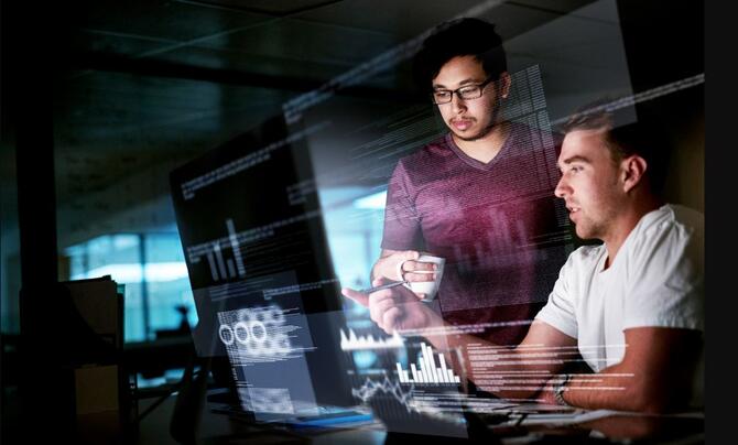 Two men at a computer