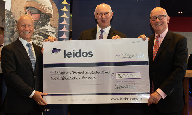 Leidos leadership present cheque to Disabled Veterans Scholarship Fund