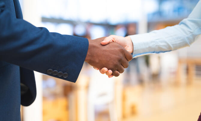 Two businesspeople shaking hands